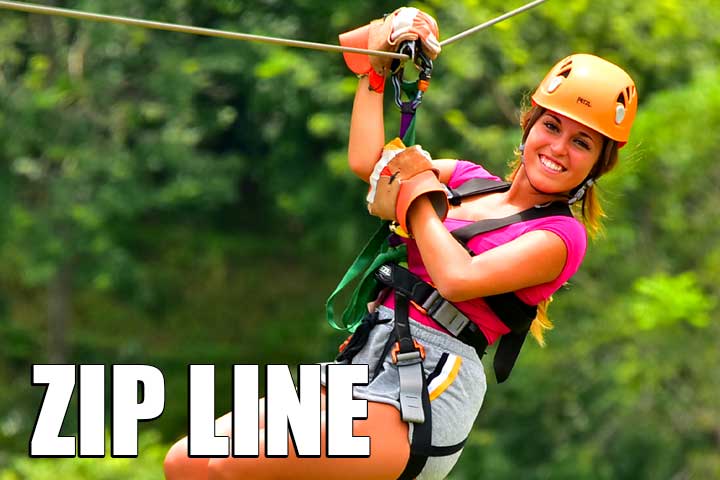 Pretty girl on zip line in costa rica