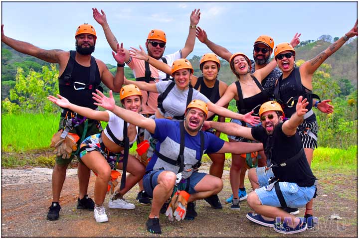 Large group of happy people with arms open