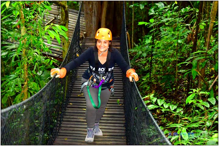 Girl on hanging bridge in costa rica