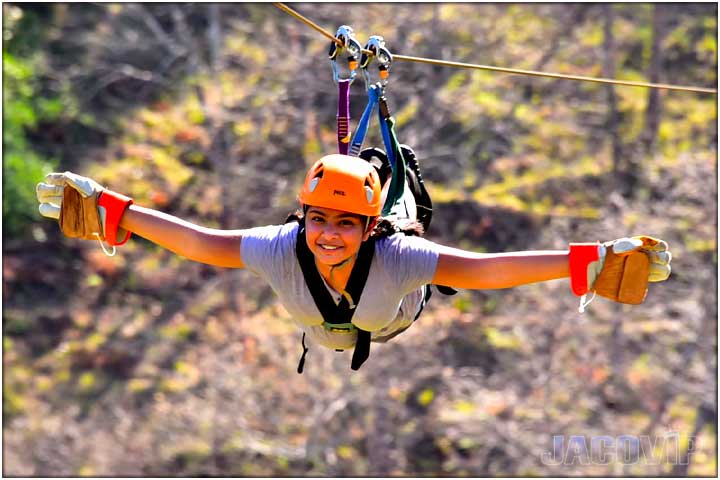 Girl on super man zip line in jaco