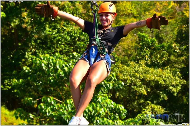 Cocnierge on zip line tour with arms open