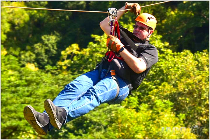 Guy with jeans and black shirt on canopy tour