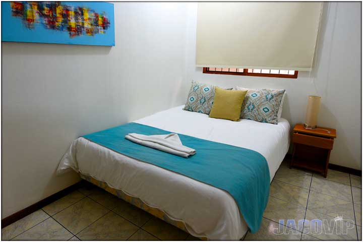 Queen size bed in separate area attached to bedroom number 1