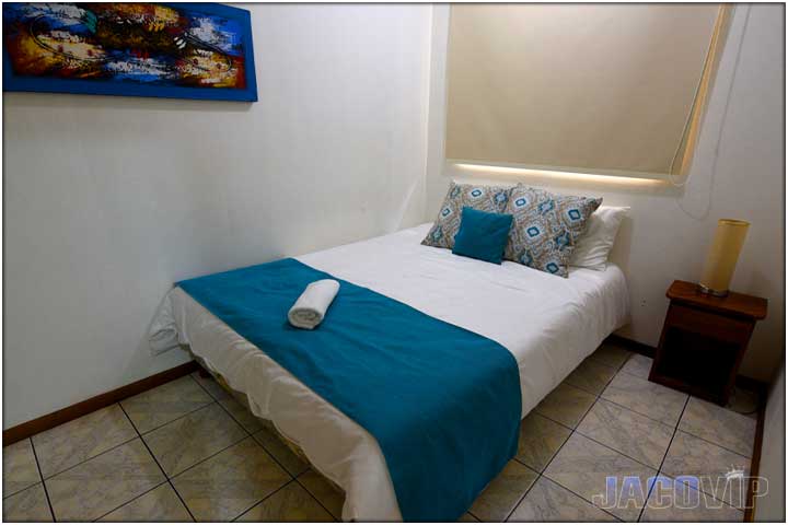 queen bed with closed door