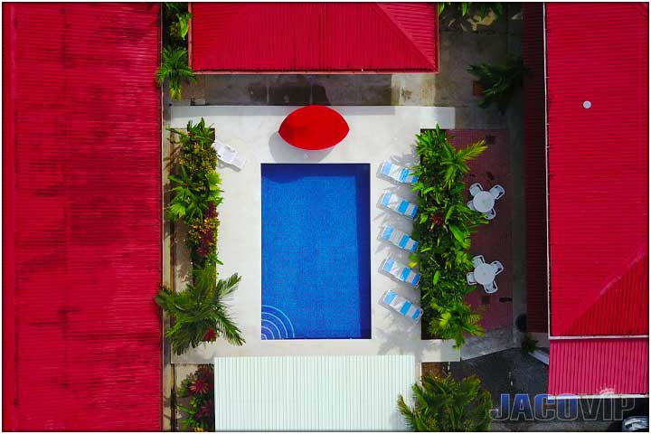 Direct overhead photo of swimming pool and edge of buidings