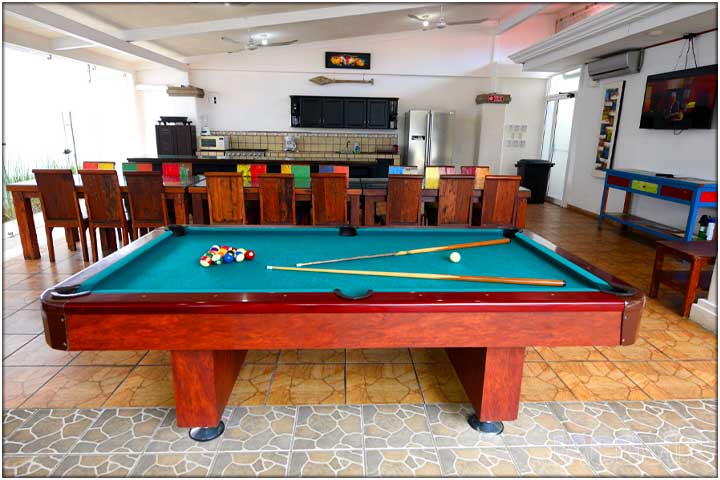 Side view of pool table in the living room area
