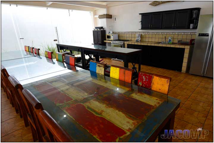 Tables and serving station next to kitchen