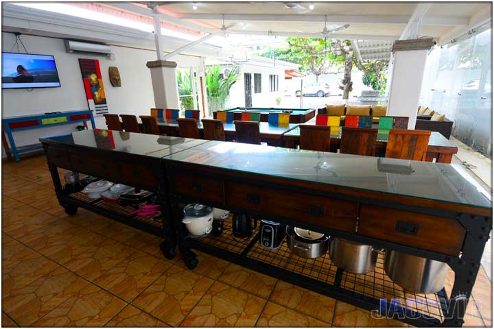 Large working area in kitchen next to dining tables