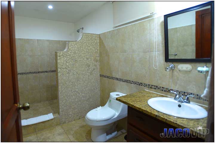 En suite bathroom with new tile work and granite for bedroom number one