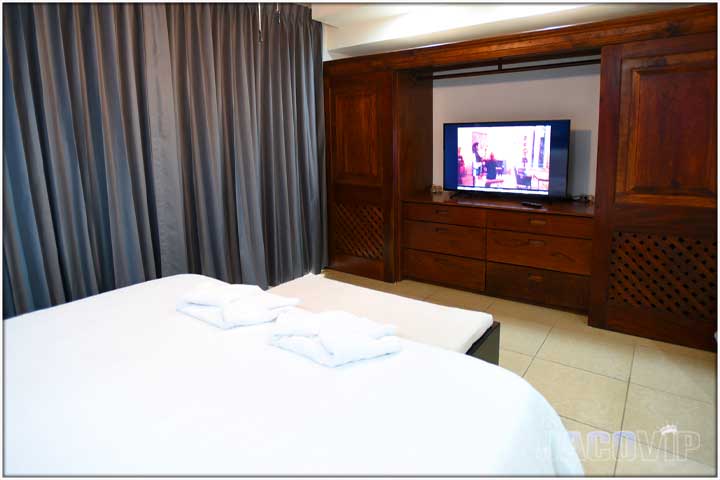 Large TV inside of built in closet furniture