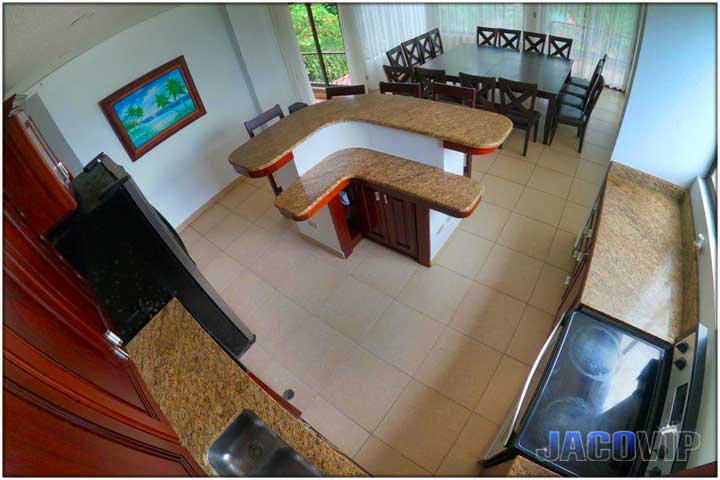 Dining Room Wide angle view of kitchen area with island and dining tables