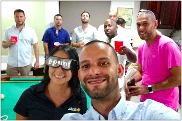 Bachelor party group with Jaco VIP concierge in front of pool table