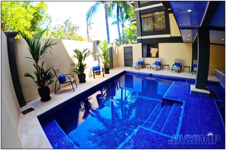 blue tiles and steps inside of multi level pool