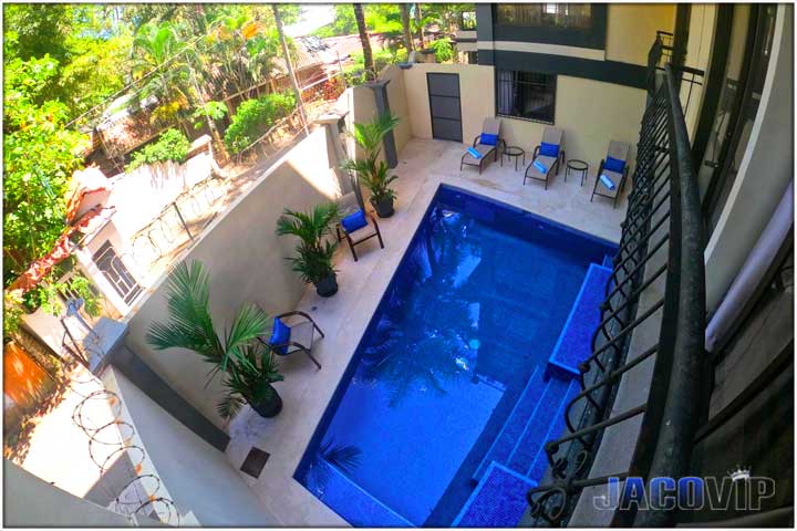 view of swimming pool and exterior from second floor window