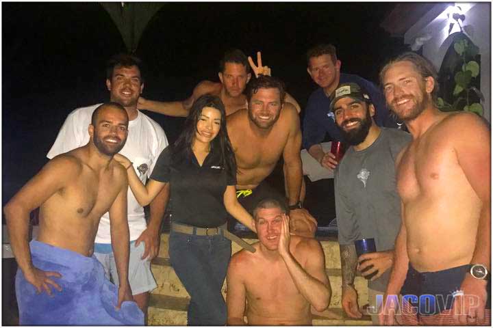 Night time photo of bachelor party group with concierge at Pacific Palms