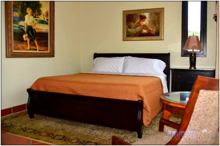 King size bed with orange duvets