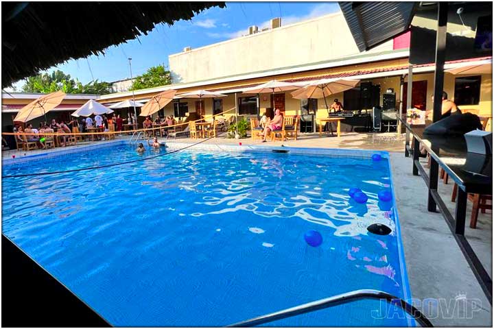 View of swimming pool and bar