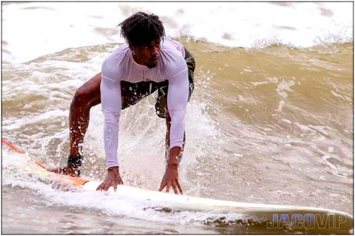 Guy taking surf lessons in Jaco