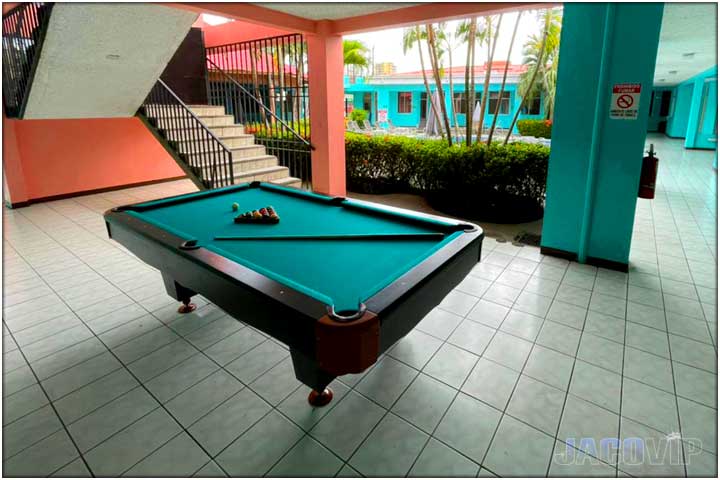 Outdoor pool table in covered area