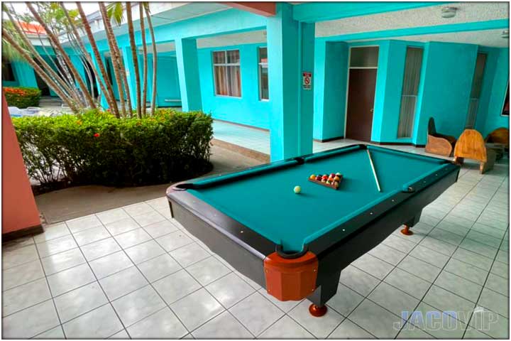 Pool table with blue green carpet