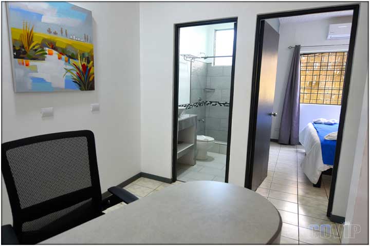 office chair and view of bathroom and bedroom