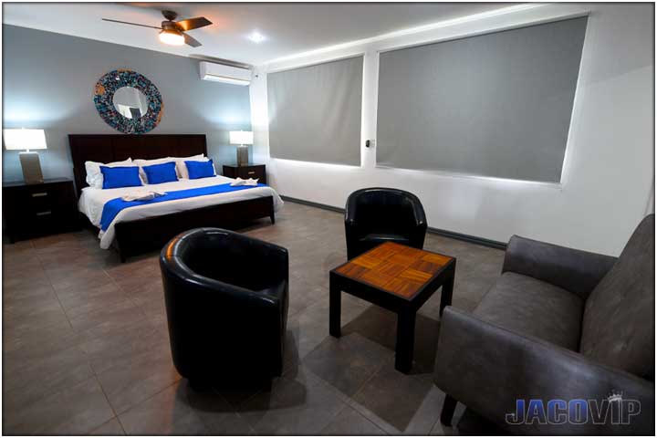 King size bed with blue accessories in master bedroom