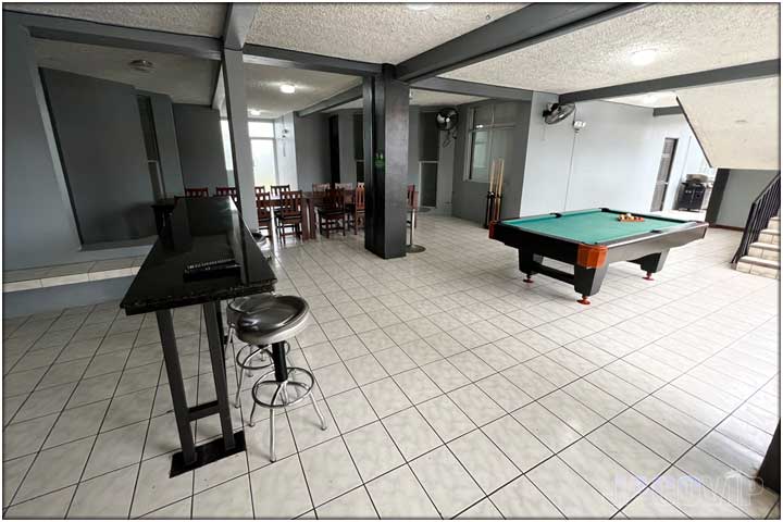 Outdoor pool table in covered area