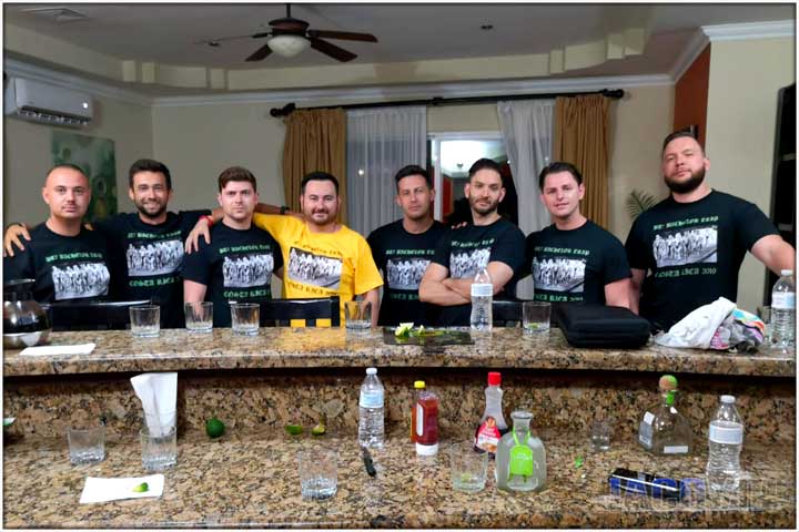 Group of guys with matching bachelor party shirts at bar