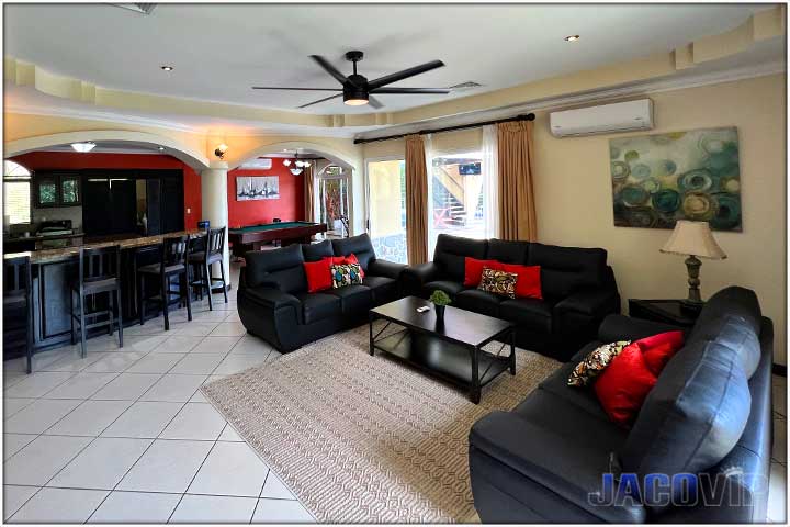 Large living room with open concept kitchen and bar