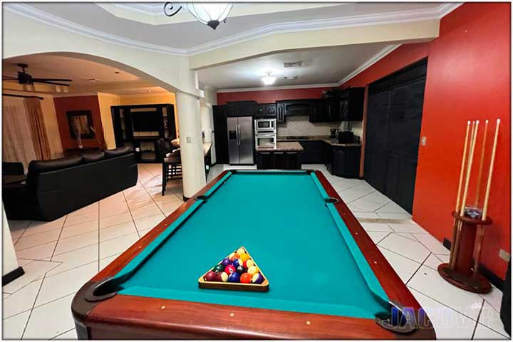 Pool table and high top table with chairs