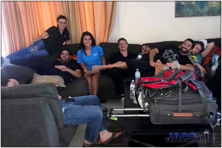 group of guys on sofa with luggage