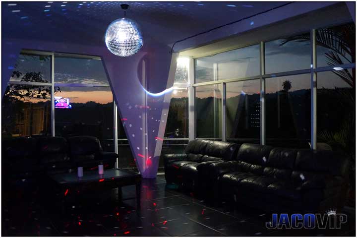 night time party room with disco ball and laser lights