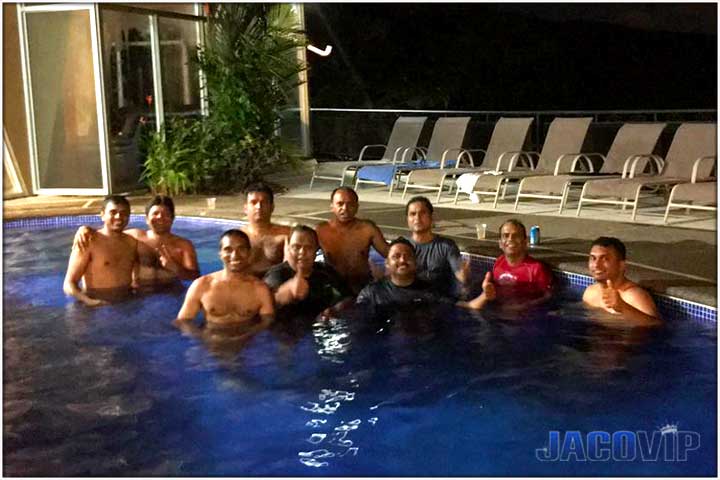 guests in the pool at night