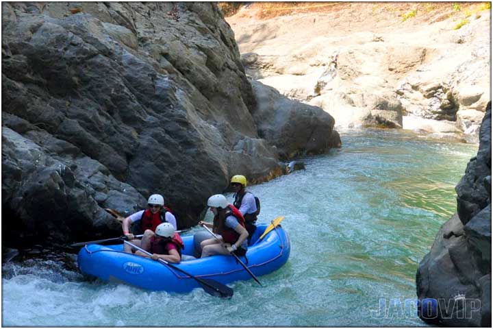 Rafting through river canyon in costa rica