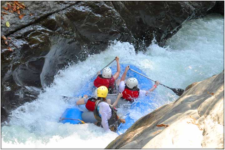 Narrow river canyon during white water rafting tour in Costa RIca