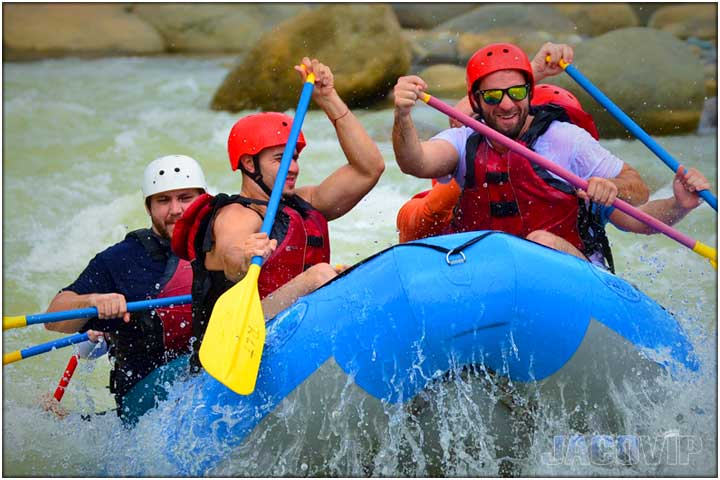 Moving fast on river rafting tour near Jaco Beach