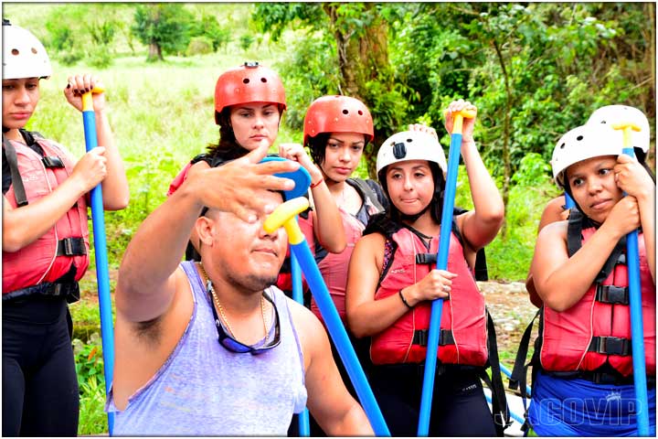 White water rafting guide giving orientation and safety instructions